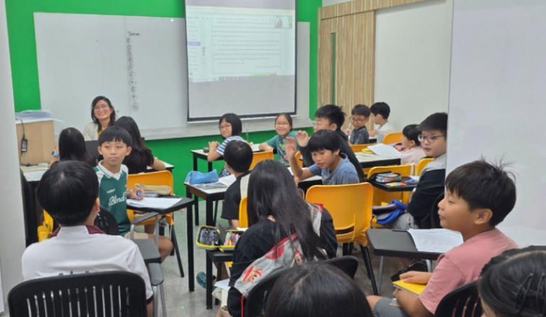 Primary school students practising composition writing at WRITERS AT WORK in Singapore