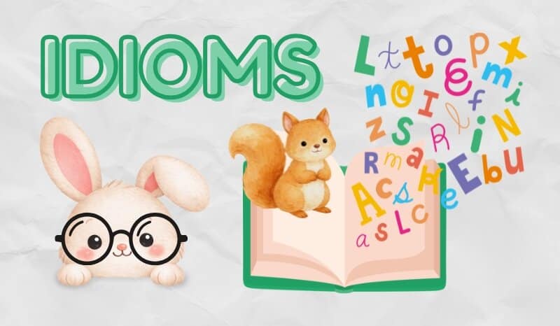 Large title "Idioms" accompanied by a colourful book and studious animals.